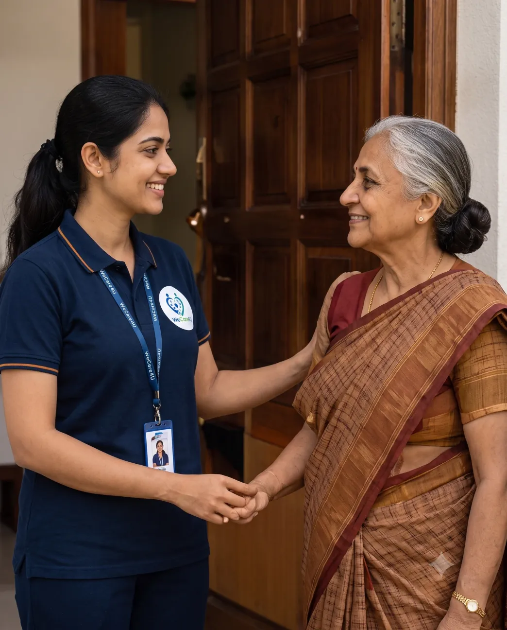 WeCare4U assistant greeting an elderly mother at her home in Chennai for pickup